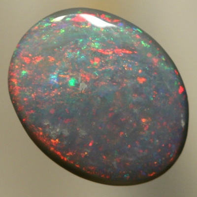 SOLID SEMI BLACK OPAL Red and orange moves constantly over green 